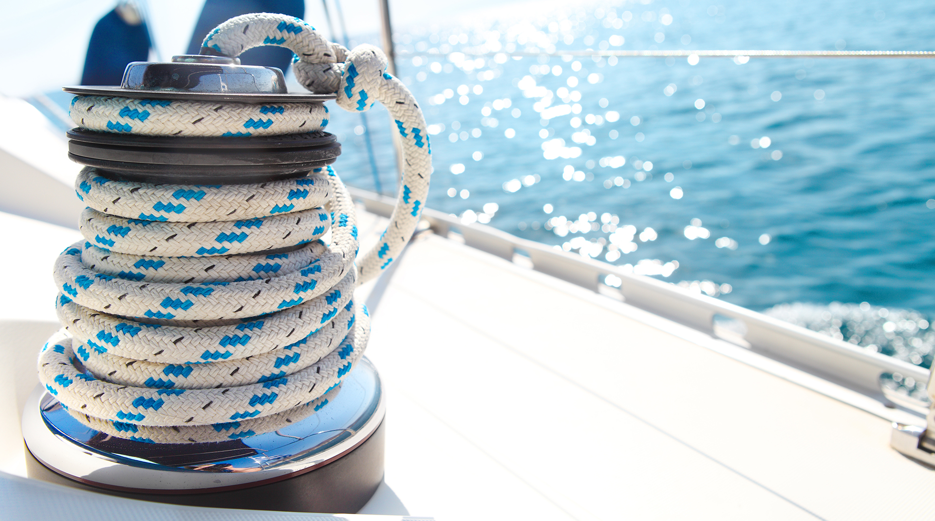 Sailboat winch and rope yacht detail